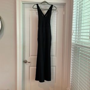 Stretch material, built in bra, cross cross back, flare leg